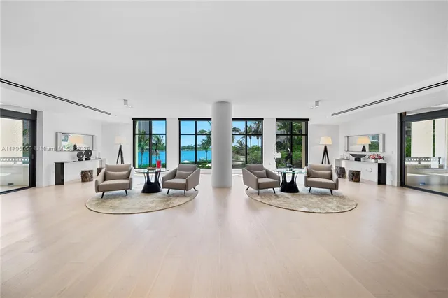 a kitchen with stainless steel appliances granite countertop a sink and a refrigerator