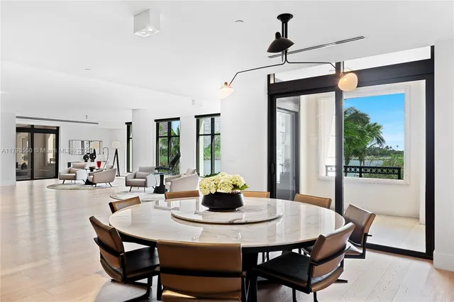 a spacious bedroom with a large bed and a large window