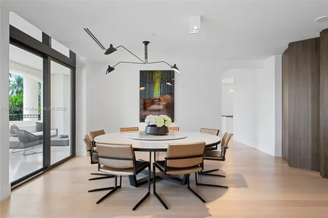 a view of a dining room with furniture and window