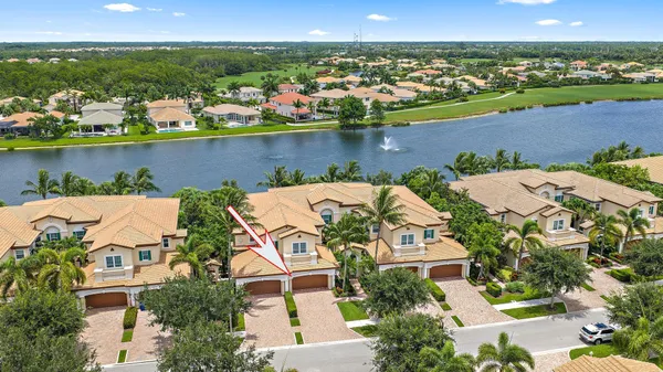 an aerial view of a house with a lake view
