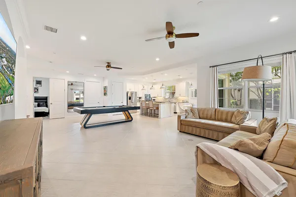 a kitchen with stainless steel appliances granite countertop a stove refrigerator sink and cabinets