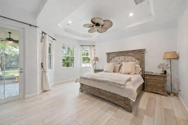 a large bathroom with a large tub and double vanity
