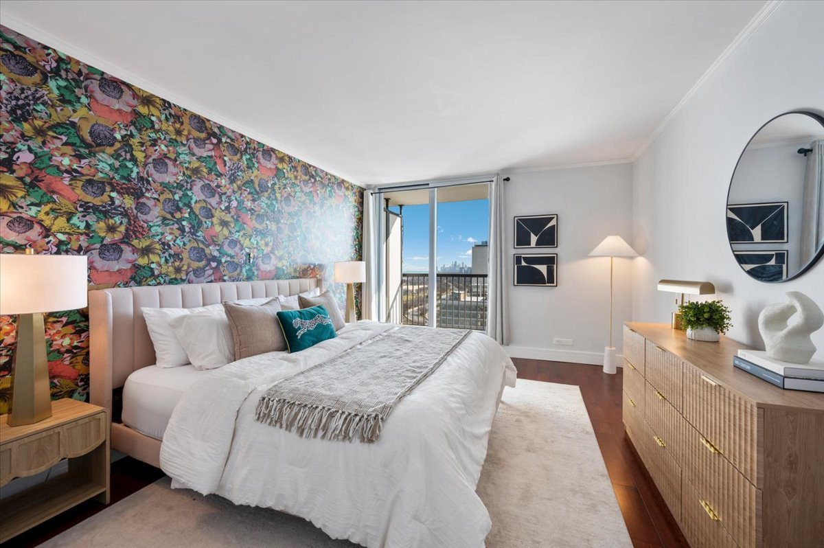 5855 North Sheridan Road, Unit 25G Chicago, IL 60660 - Photo 13 of 29 a bed room with a bed window and a chair