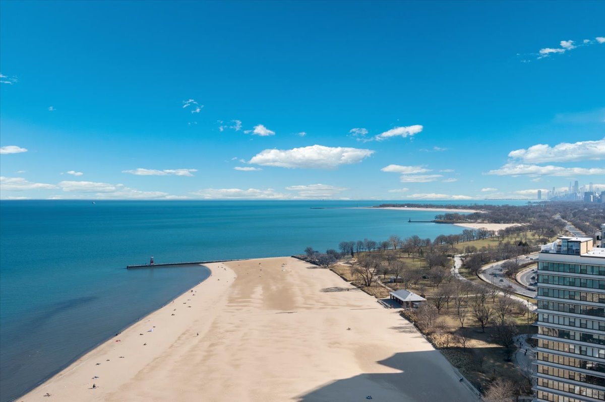 5855 North Sheridan Road, Unit 25G Chicago, IL 60660 - Photo 21 of 29 a view of a lake and a yard