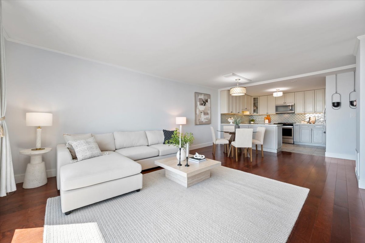 5855 North Sheridan Road, Unit 25G Chicago, IL 60660 - Photo 9 of 29 a living room with furniture white wooden floor and a kitchen view
