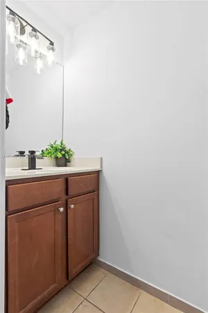 a room with a sink and cabinets