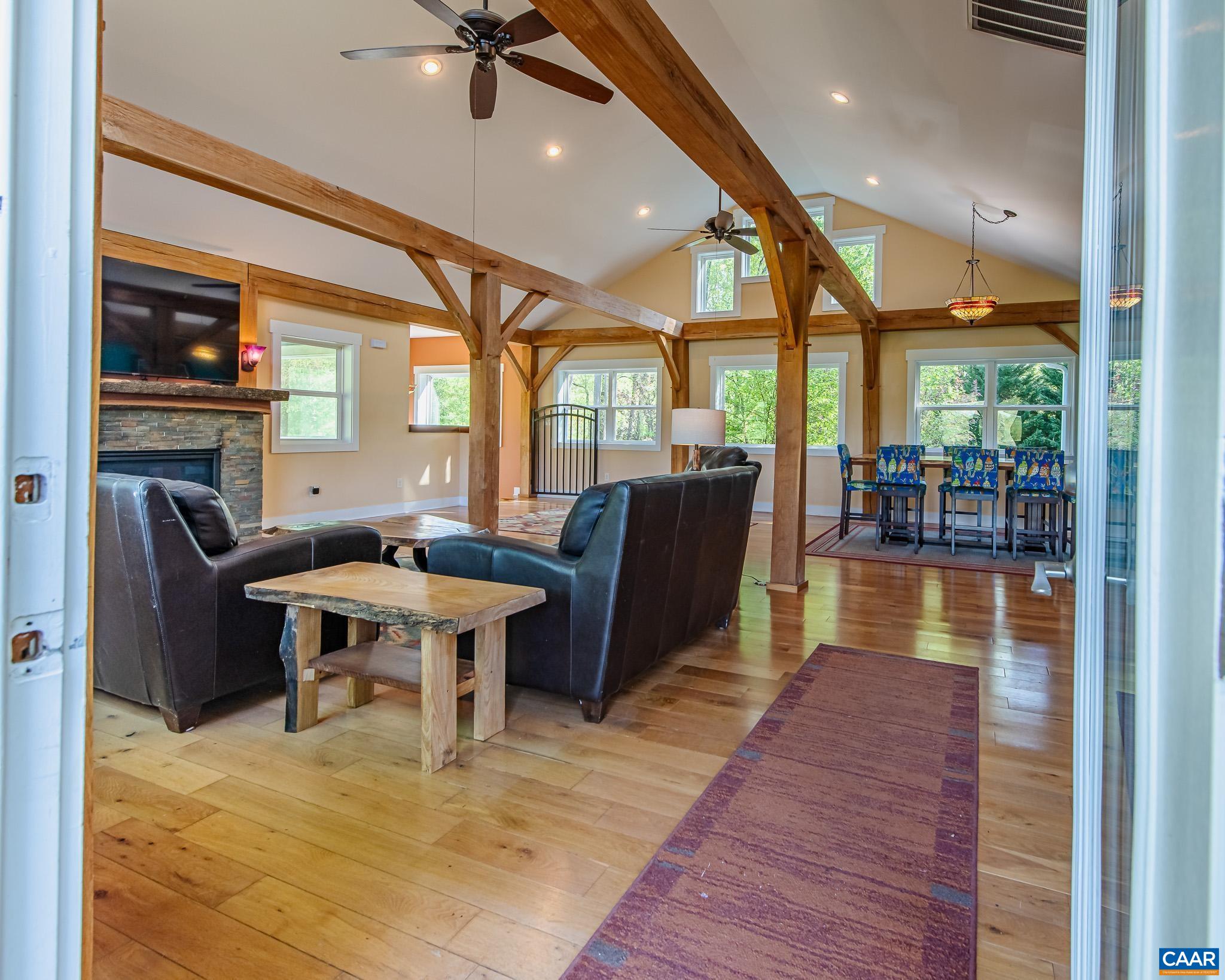 1671 Dudley Mountain Road Charlottesville, VA 22903 - Photo 4 of 60 a view of a dining room with furniture window and wooden floor