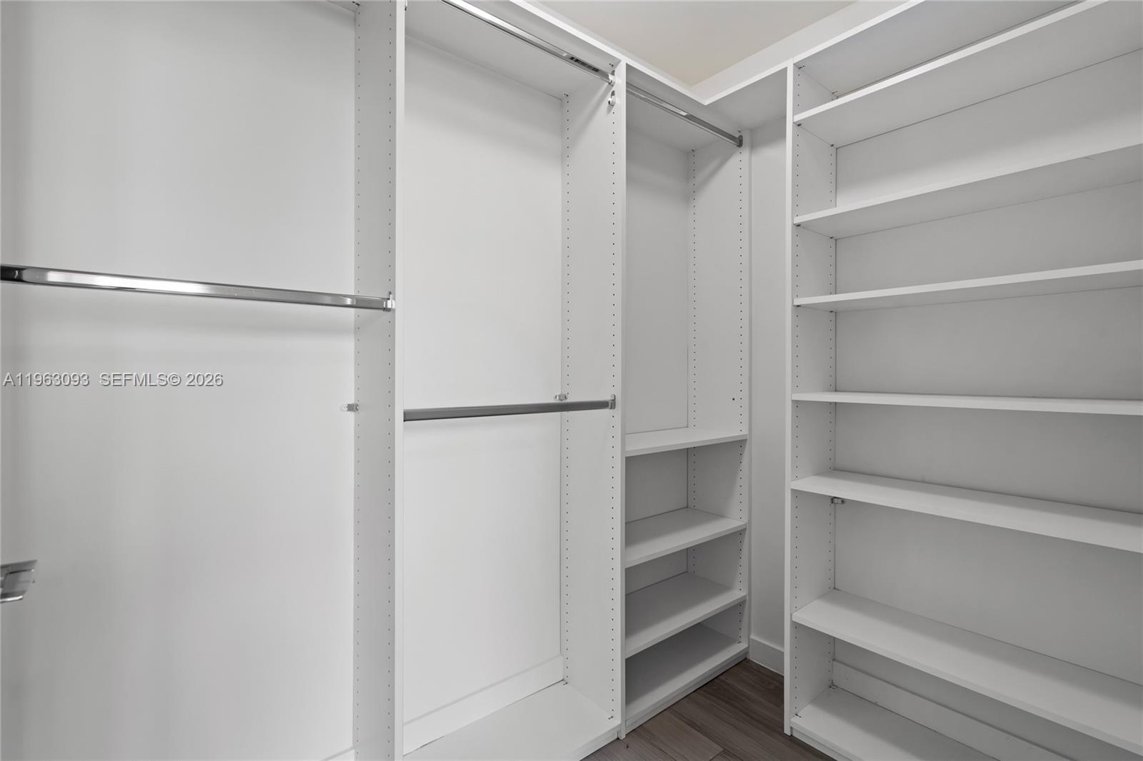 999 Southwest 1st Avenue, Unit 2411 Miami, FL 33130 - Photo 20 of 72 a view of walk in closet with empty racks