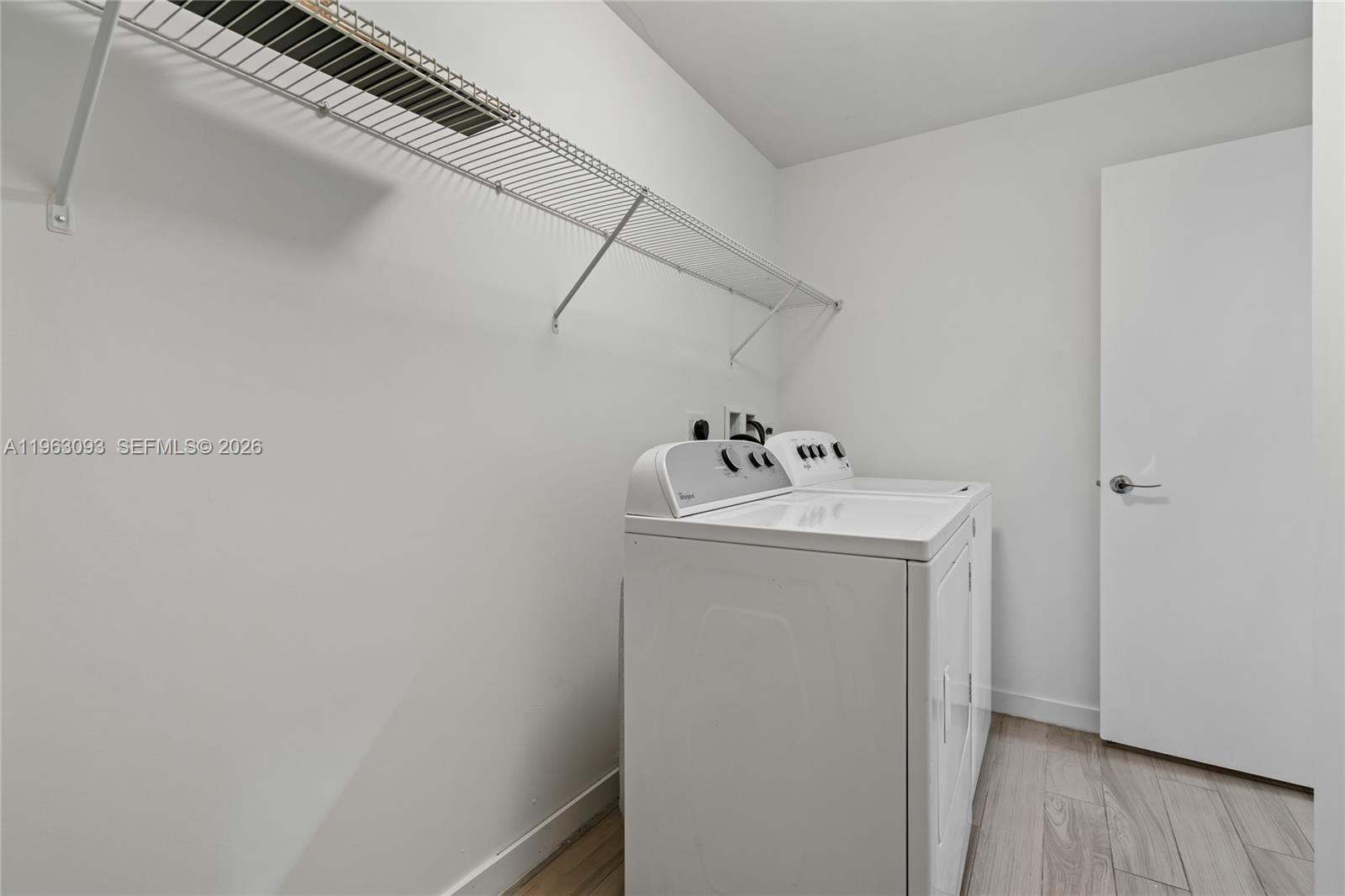 999 Southwest 1st Avenue, Unit 2411 Miami, FL 33130 - Photo 28 of 72 a utility room with dryer and washer