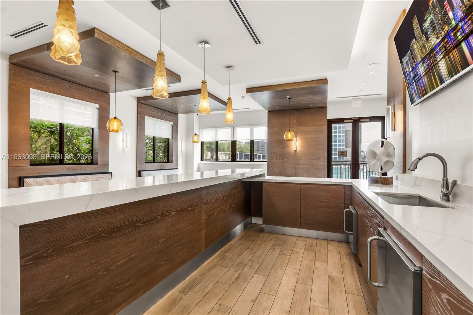 999 Southwest 1st Avenue, Unit 2411 Miami, FL 33130 - Photo 45 of 72 a large kitchen with a sink and large window