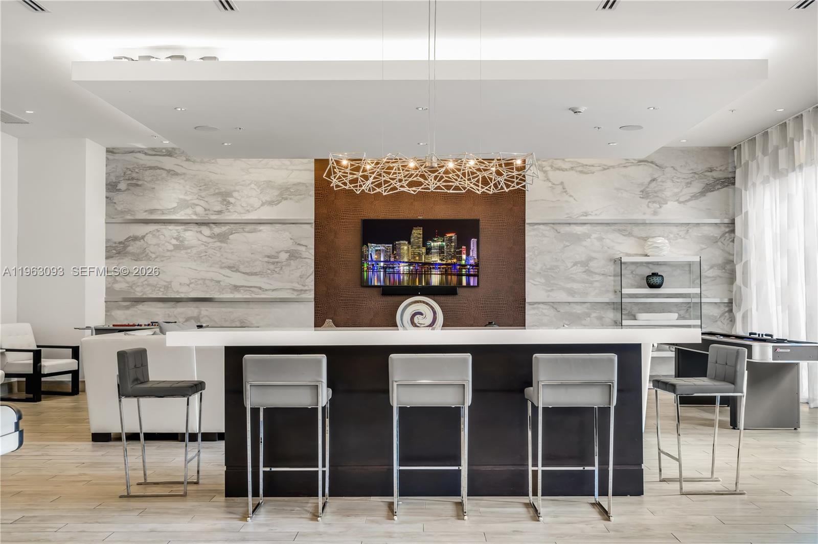 999 Southwest 1st Avenue, Unit 2411 Miami, FL 33130 - Photo 48 of 72 a kitchen with a sink cabinets and wooden floor