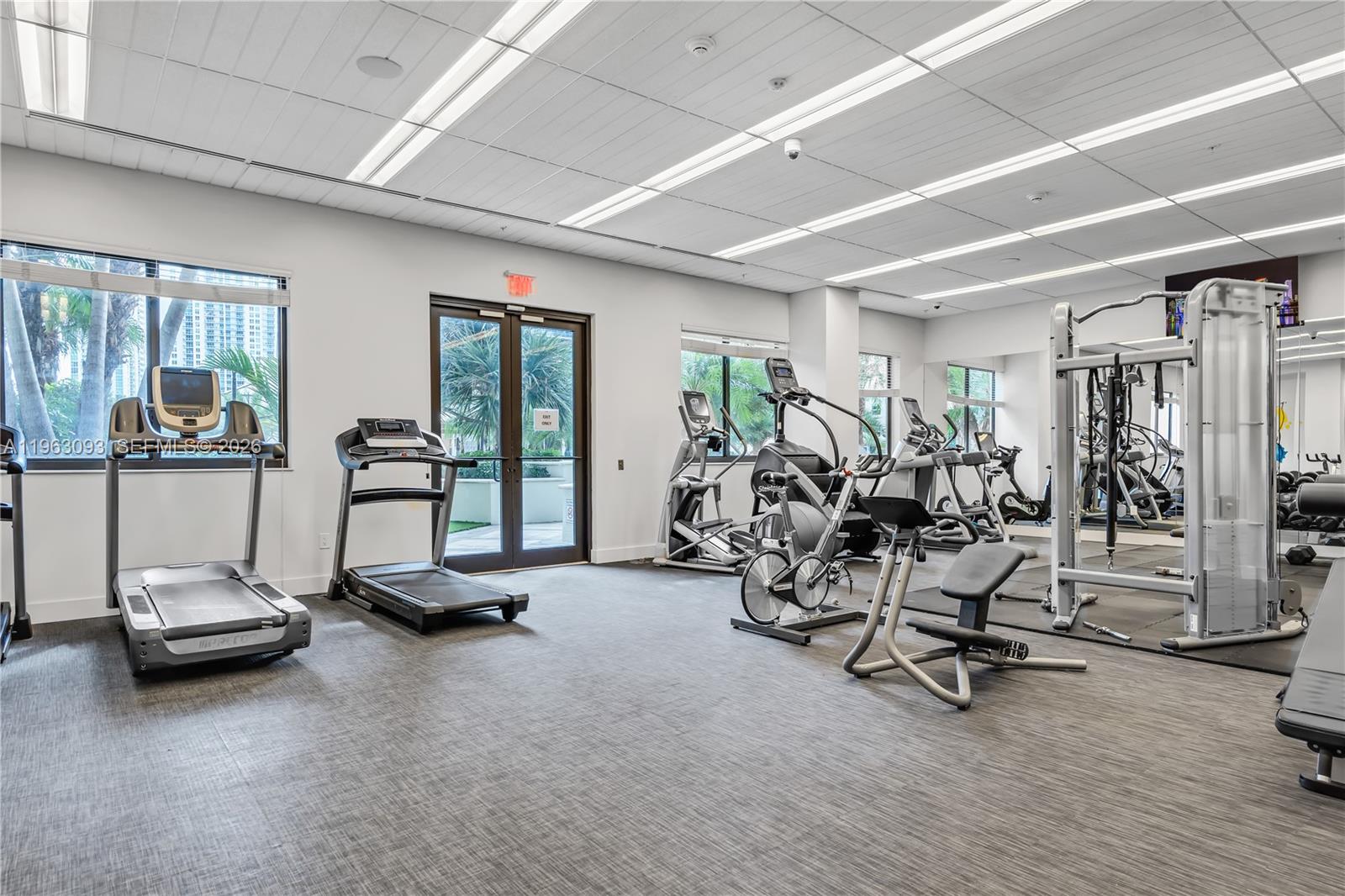 999 Southwest 1st Avenue, Unit 2411 Miami, FL 33130 - Photo 51 of 72 a view of a room with gym equipment