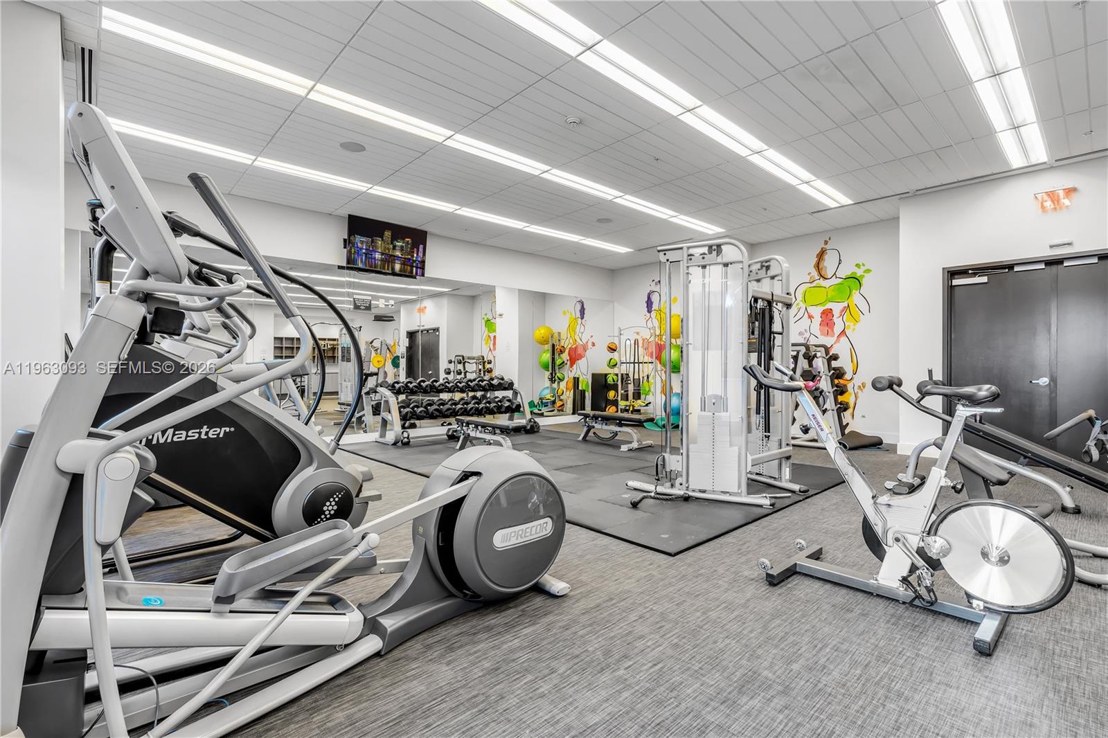 999 Southwest 1st Avenue, Unit 2411 Miami, FL 33130 - Photo 54 of 72 a view of a room with gym equipment
