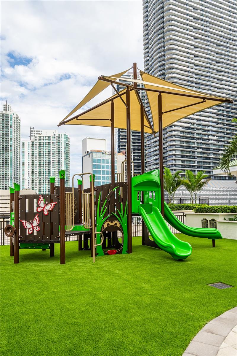999 Southwest 1st Avenue, Unit 2411 Miami, FL 33130 - Photo 64 of 72 a view of a garden with a slide