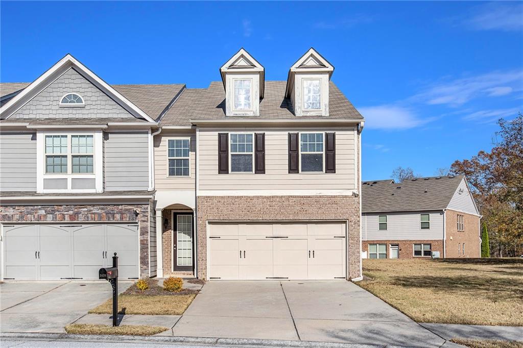 a front view of a house with a yard
