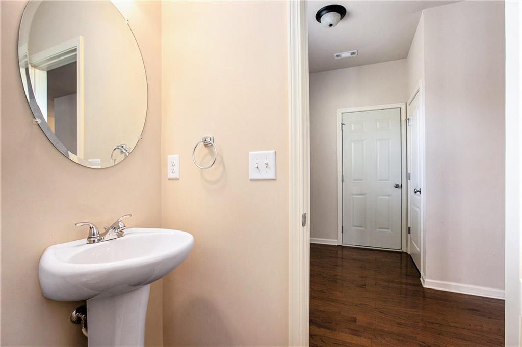 2426 Bellyard Drive Buford, GA 30519 - Photo 13 of 25 a bathroom with a sink and mirror