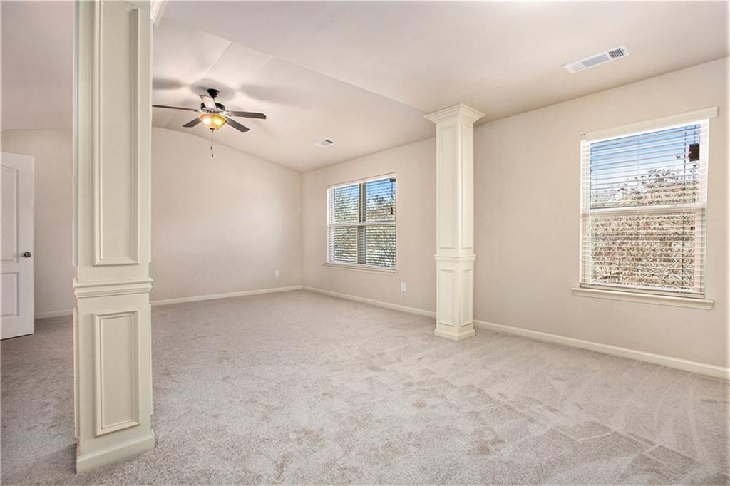 2426 Bellyard Drive Buford, GA 30519 - Photo 15 of 25 wooden floor in an empty room with a window