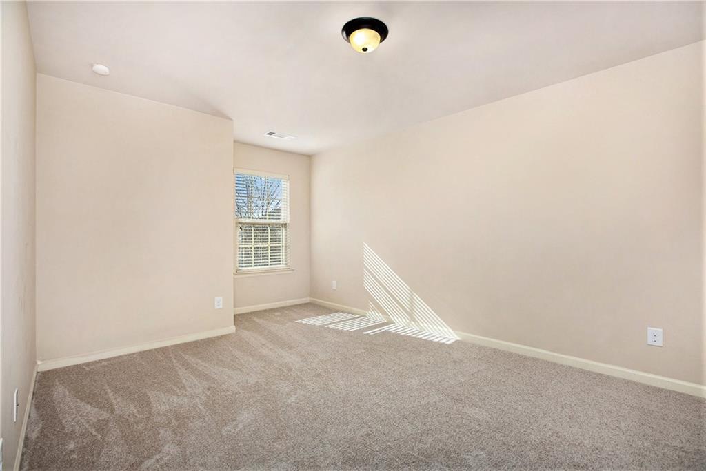 2426 Bellyard Drive Buford, GA 30519 - Photo 20 of 25 a view of a livingroom with an empty space