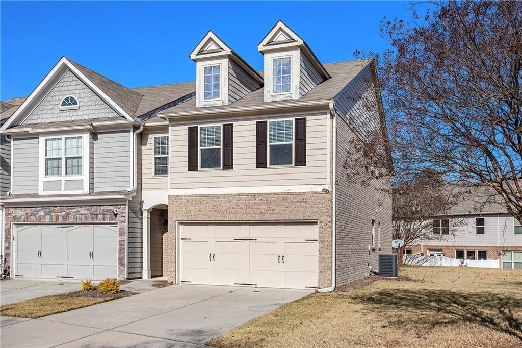 2426 Bellyard Drive Buford, GA 30519 - Photo 2 of 25 a front view of a house with a yard
