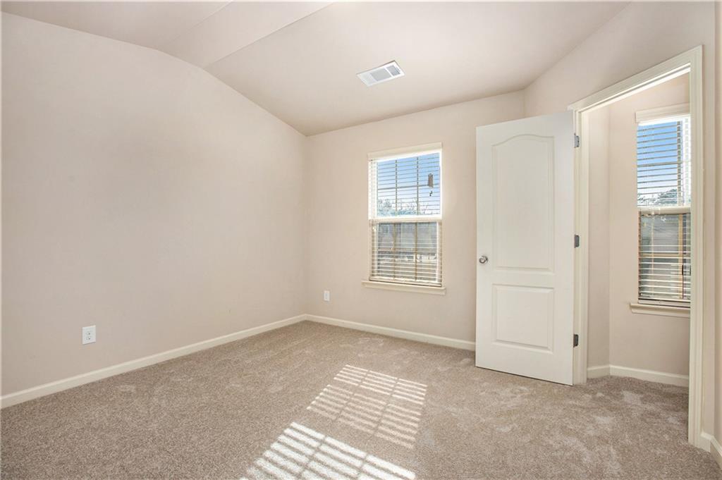 2426 Bellyard Drive Buford, GA 30519 - Photo 21 of 25 an empty room with windows