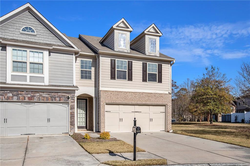 2426 Bellyard Drive Buford, GA 30519 - Photo 3 of 25 a front view of a house with a yard