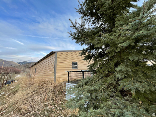 333 Lago Liberty Road Grace, ID 83241 - Photo 10 of 35 View of side of home featuring a mountain view