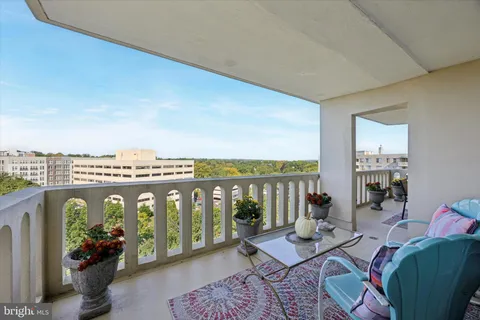 a living room with furniture fireplace and mountain view
