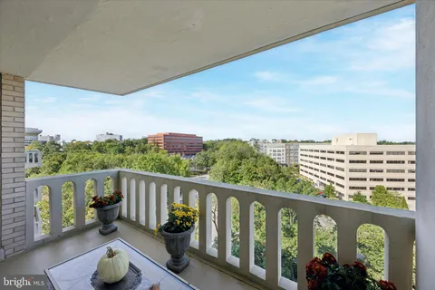 a view of a balcony with chairs
