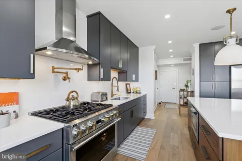a kitchen with a stove and cabinets