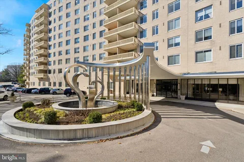 a view of a swimming pool with a chairs