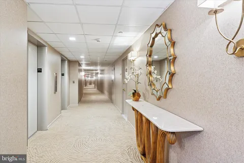 a view of a hallway with stairs