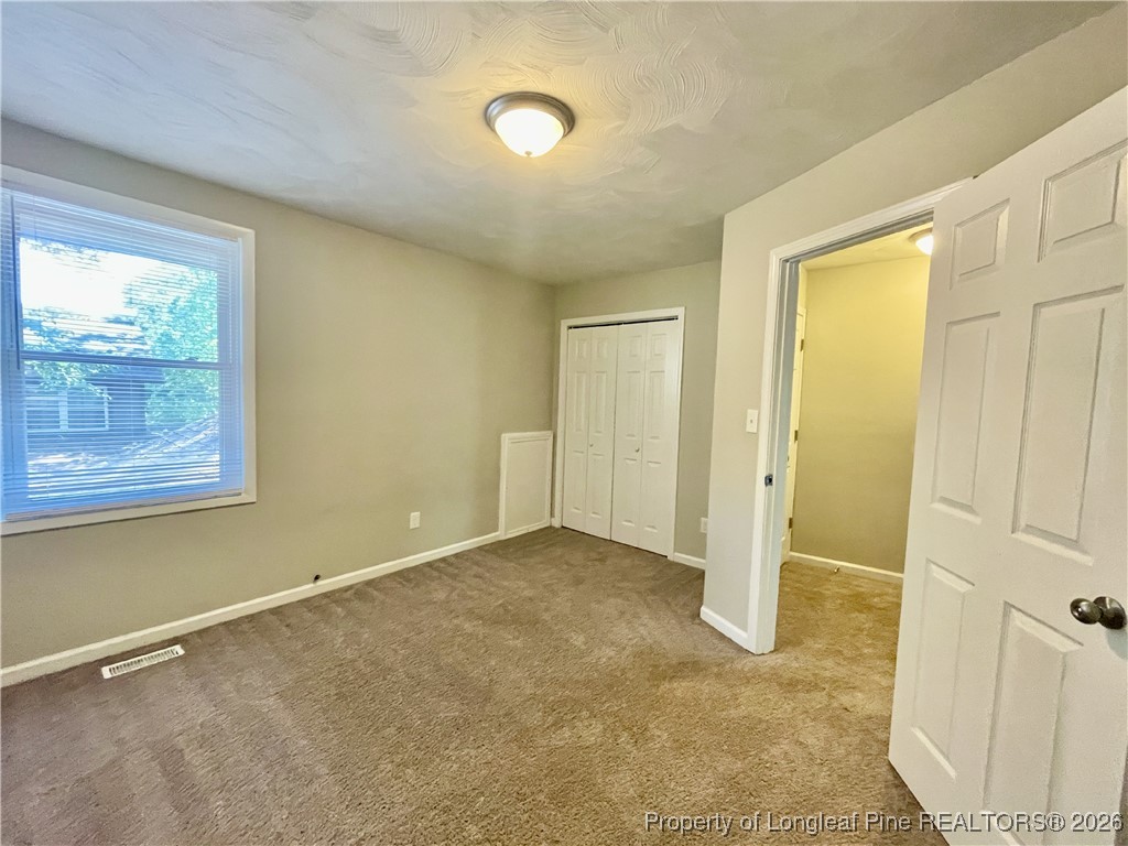 820 Anarine Road, Unit A Fayetteville, NC 28303 - Photo 14 of 22 a view of an empty room with a window