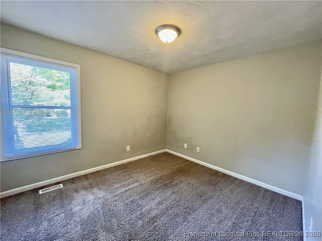 820 Anarine Road, Unit A Fayetteville, NC 28303 - Photo 18 of 22 an empty room with a window