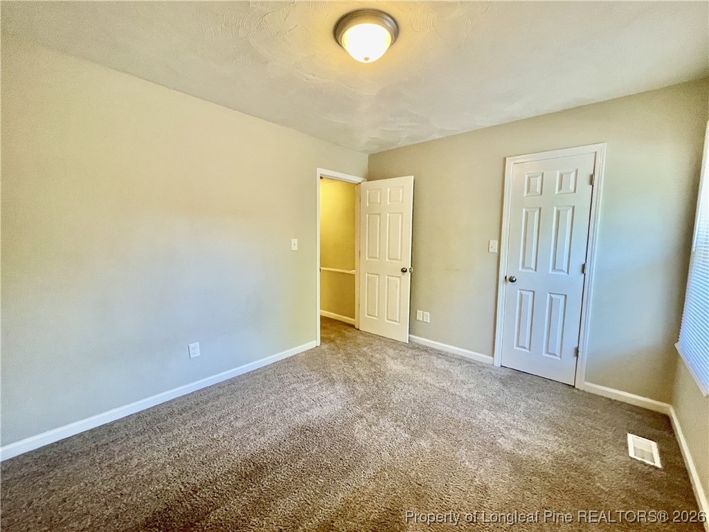 820 Anarine Road, Unit A Fayetteville, NC 28303 - Photo 19 of 22 an empty room with closet area