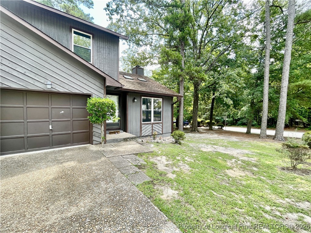 820 Anarine Road, Unit A Fayetteville, NC 28303 - Photo 2 of 22 a view of a house with backyard and trees