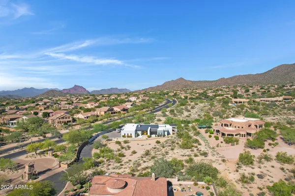 an aerial view of residential houses with outdoor space