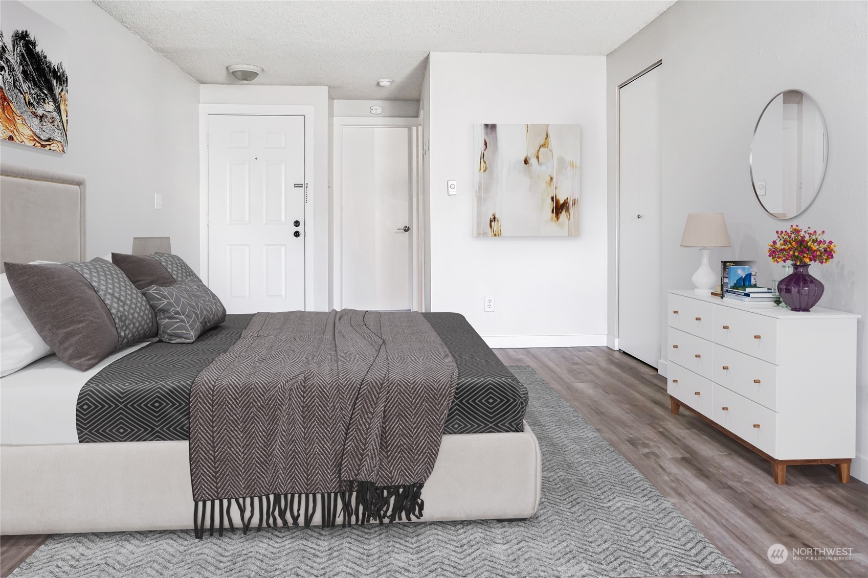 15210 Macadam Road South, Unit D205 Tukwila, WA 98188 - Photo 11 of 11 a bedroom with a bed and cabinets