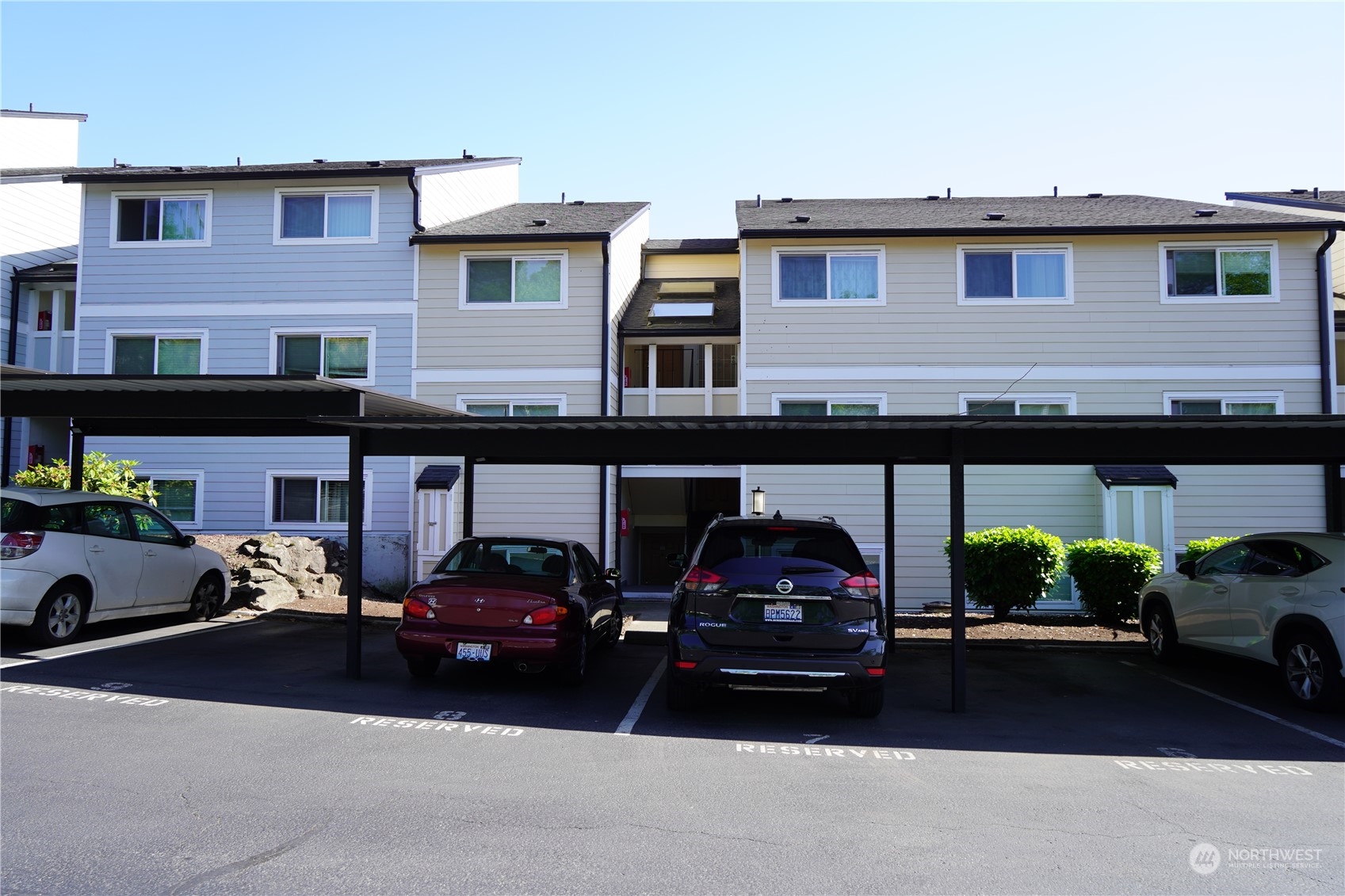 15210 Macadam Road South, Unit D205 Tukwila, WA 98188 - Photo 3 of 11 a car parked in front of a building
