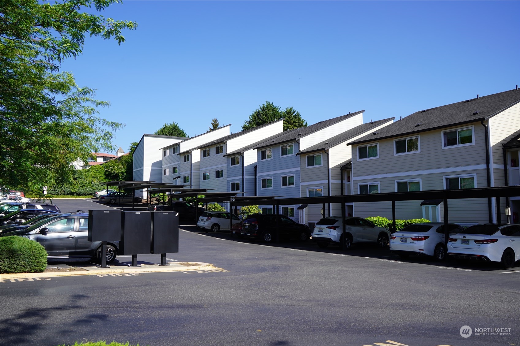 15210 Macadam Road South, Unit D205 Tukwila, WA 98188 - Photo 4 of 11 a front view of a building with street view