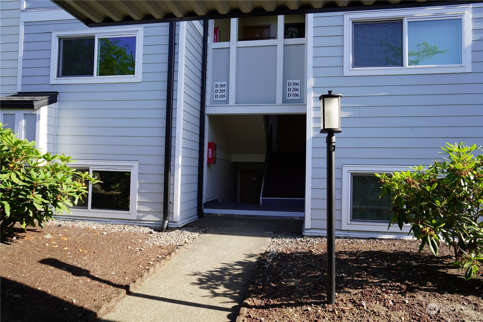 15210 Macadam Road South, Unit D205 Tukwila, WA 98188 - Photo 5 of 11 a house with sign broad