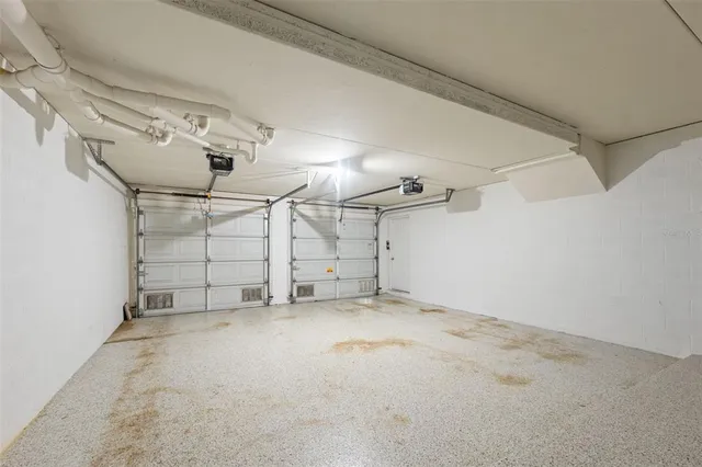 a view of a lake with a table and chairs