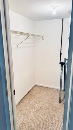 a bathroom with a granite countertop toilet a sink and a shower