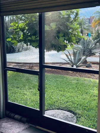 a view of front door with outdoor seating