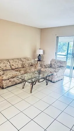 a bedroom with a bed and cabinets