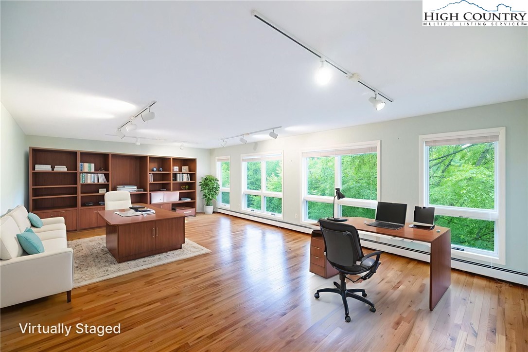 2530 Bear Wallow Road Lansing, NC 28643 - Photo 26 of 48 a view of a livingroom with workspace and a large window