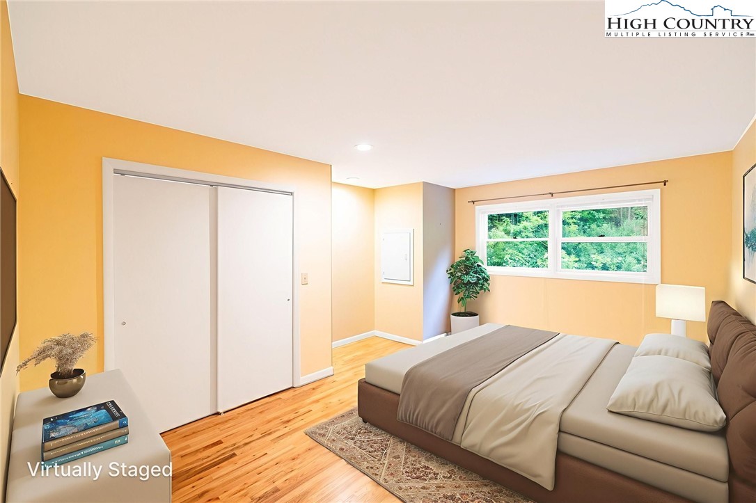 2530 Bear Wallow Road Lansing, NC 28643 - Photo 29 of 48 a bedroom with a bed and a window