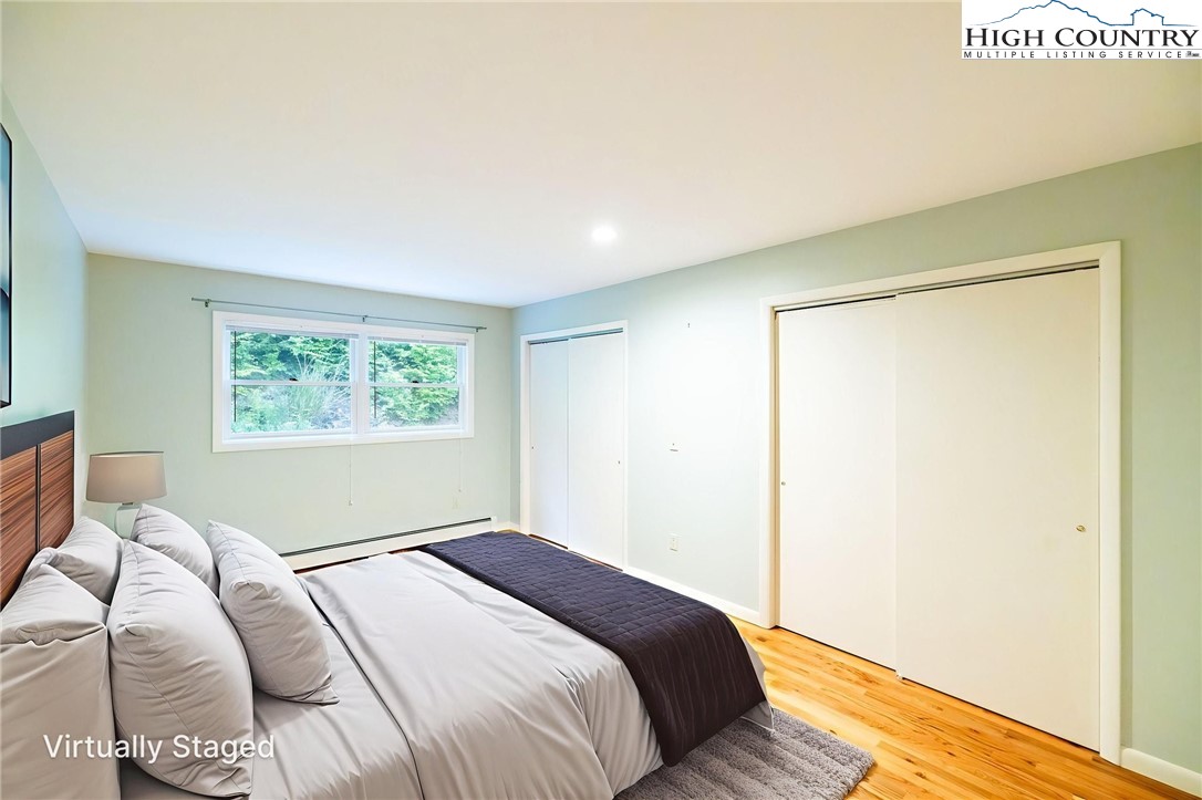 2530 Bear Wallow Road Lansing, NC 28643 - Photo 31 of 48 a bedroom with a bed and a window