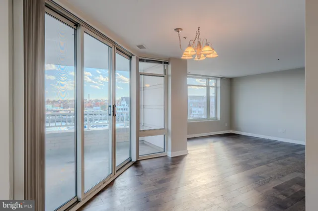 a view of an entryway with wooden floor door