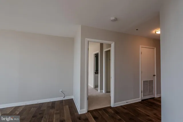 a view of a hallway with a room