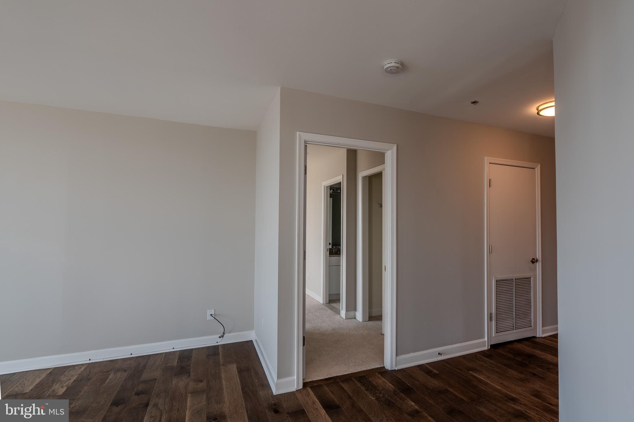 100 Harborview Drive, Unit 302 Baltimore, MD 21230 - Photo 20 of 48 a view of a hallway with wooden floor and closet